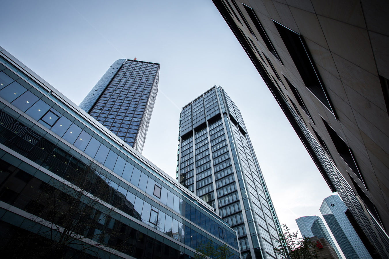 Low angle shot of high rise buildings under the clear sky in Frankfurt, Germany